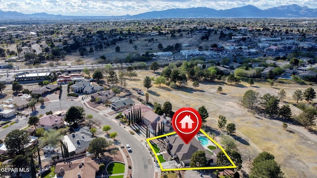 11179 Leo Collins Dr, El Paso, TX 79936 - aerial view of property and surrounding area with mountains, nearby suburban area, and property parcel outlined