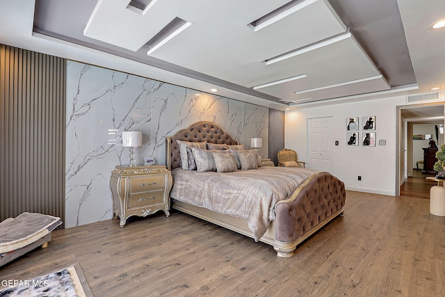11179 Leo Collins Dr, El Paso, TX 79936 - bedroom with a tray ceiling, wood finished floors, a closet, and recessed lighting