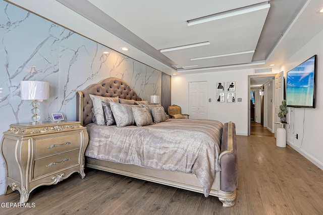 11179 Leo Collins Dr, El Paso, TX 79936 - bedroom with wood finished floors, baseboards, and a closet