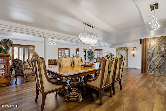 11179 Leo Collins Dr, El Paso, TX 79936 - dining room with healthy amount of natural light, dark wood-type flooring, decorative columns, and baseboards