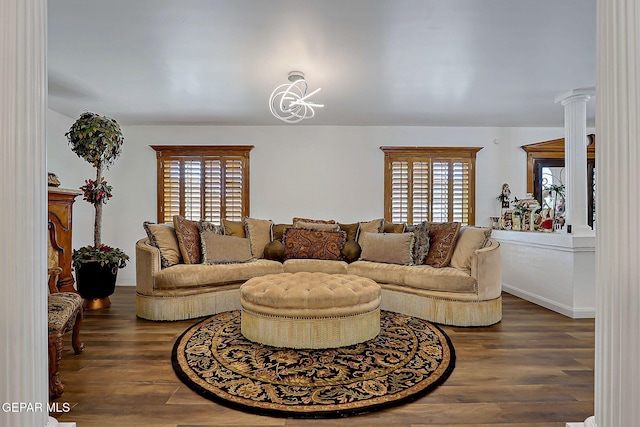 11179 Leo Collins Dr, El Paso, TX 79936 - living area featuring wood finished floors, plenty of natural light, and ornate columns