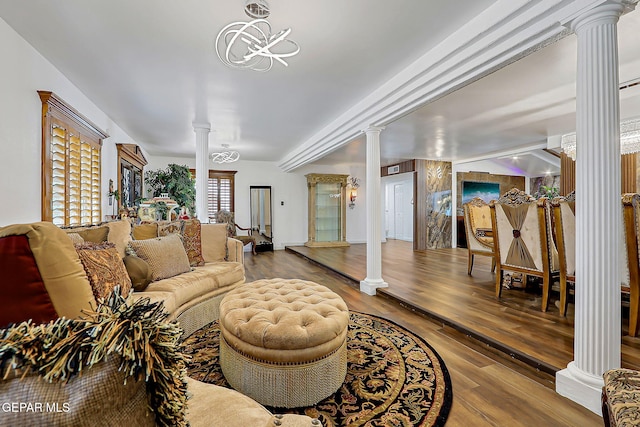 11179 Leo Collins Dr, El Paso, TX 79936 - living area featuring decorative columns and wood finished floors