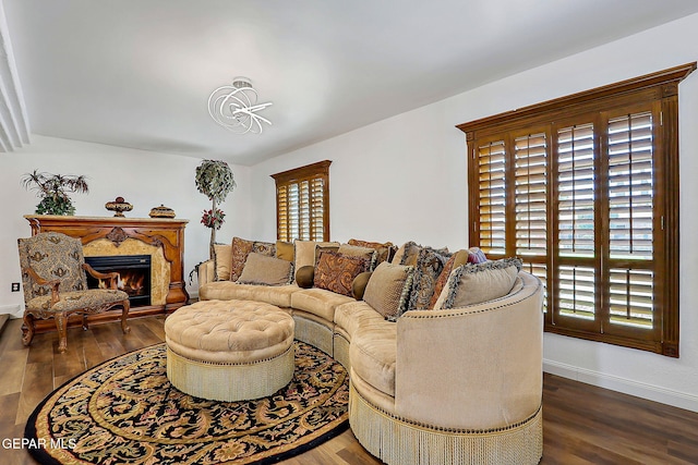 11179 Leo Collins Dr, El Paso, TX 79936 - living area featuring healthy amount of natural light, baseboards, and wood finished floors