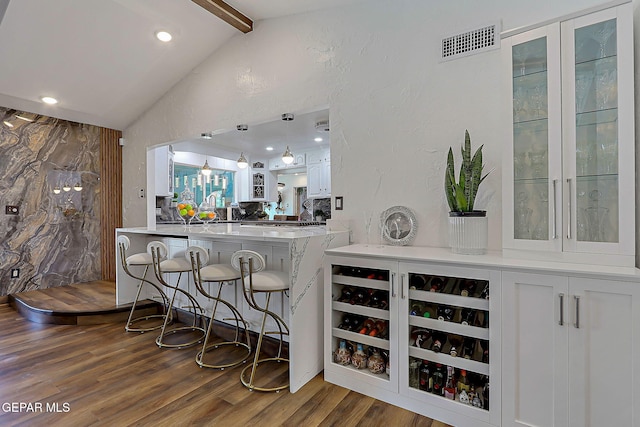 11179 Leo Collins Dr, El Paso, TX 79936 - bar with dark wood-type flooring and hanging light fixtures