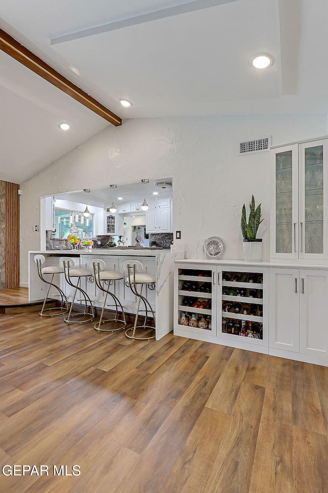 11179 Leo Collins Dr, El Paso, TX 79936 - bar featuring wood finished floors and recessed lighting