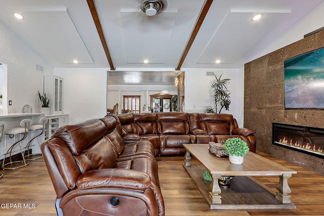 11179 Leo Collins Dr, El Paso, TX 79936 - living area featuring wood finished floors, a fireplace, ceiling fan, and recessed lighting