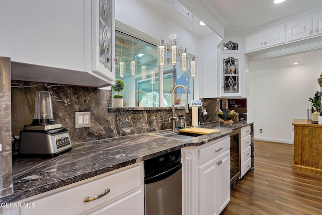 11179 Leo Collins Dr, El Paso, TX 79936 - kitchen featuring dark wood finished floors, white cabinets, backsplash, glass insert cabinets, and recessed lighting