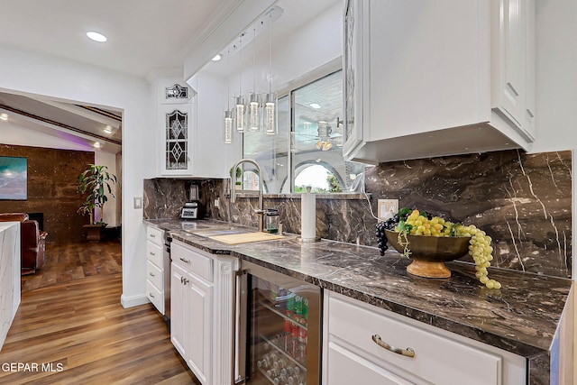 11179 Leo Collins Dr, El Paso, TX 79936 - indoor wet bar featuring wine cooler, light wood-type flooring, backsplash, and recessed lighting
