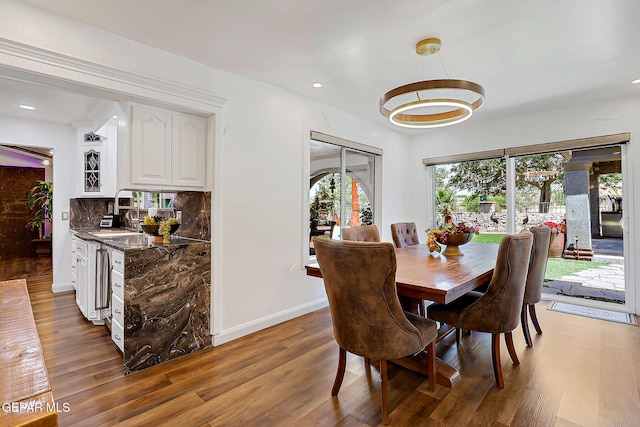 11179 Leo Collins Dr, El Paso, TX 79936 - dining room featuring wood finished floors, recessed lighting, and baseboards