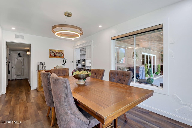 11179 Leo Collins Dr, El Paso, TX 79936 - dining area with dark wood-style floors, recessed lighting, and baseboards