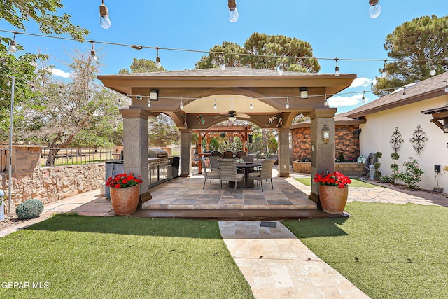 11179 Leo Collins Dr, El Paso, TX 79936 - view of patio / terrace with a gazebo, an outdoor kitchen, a ceiling fan, and grilling area