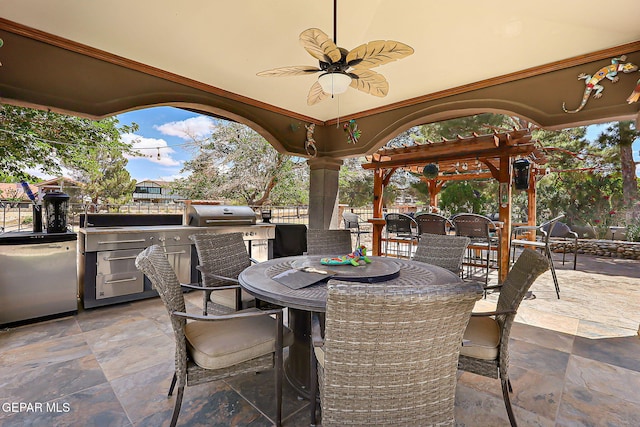 11179 Leo Collins Dr, El Paso, TX 79936 - view of patio featuring an outdoor kitchen, outdoor dining space, and ceiling fan
