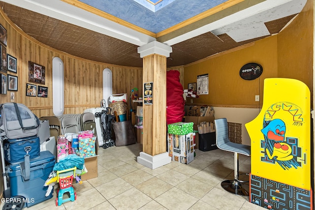 11179 Leo Collins Dr, El Paso, TX 79936 - miscellaneous room featuring wood walls, decorative columns, tile patterned floors, and an ornate ceiling