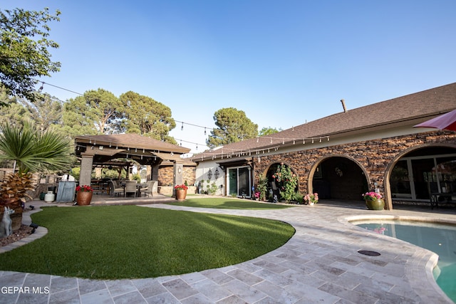 11179 Leo Collins Dr, El Paso, TX 79936 - view of green lawn featuring a gazebo, a patio area, and an outdoor pool