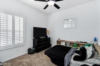 bedroom with ceiling fan and carpet