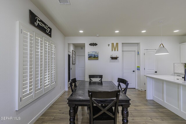 dining space featuring light hardwood / wood-style floors