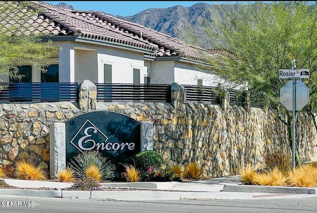 community sign featuring a mountain view