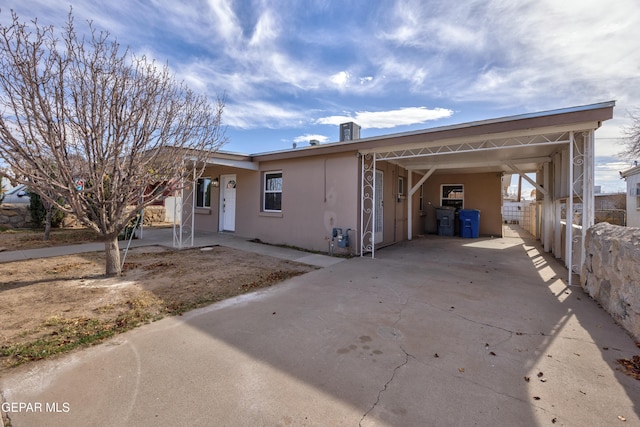 view of front of home with a carport