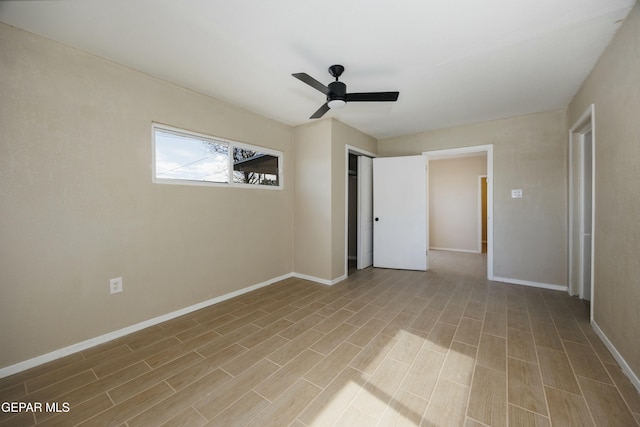 empty room with ceiling fan and light wood-type flooring