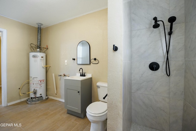 bathroom featuring a shower, vanity, gas water heater, and toilet