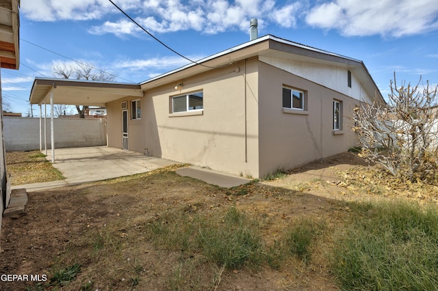 rear view of house with a carport