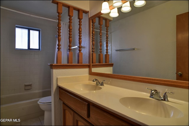 full bathroom featuring tile patterned floors, vanity, toilet, and tiled shower / bath