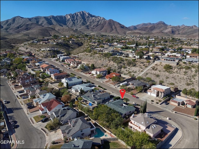 birds eye view of property featuring a mountain view