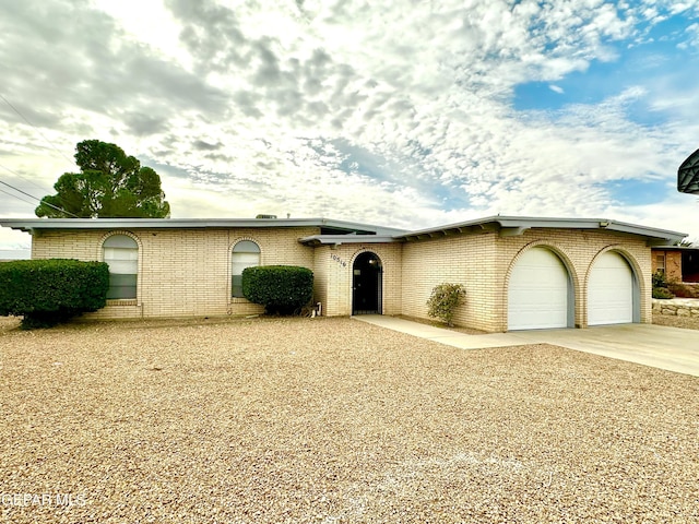 ranch-style home featuring a garage