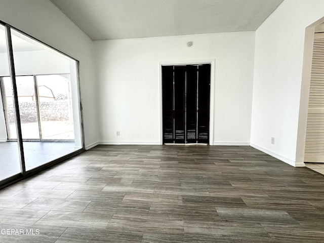 spare room with a textured ceiling