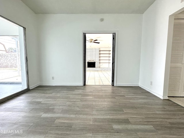 spare room featuring a fireplace