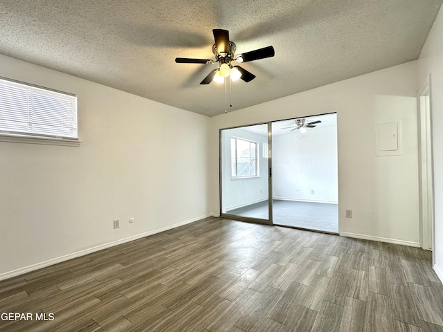 unfurnished bedroom featuring hardwood / wood-style floors, ceiling fan, a textured ceiling, and a closet