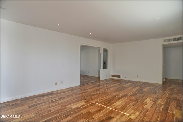 unfurnished room featuring light wood-type flooring