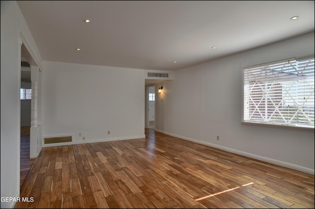 empty room featuring wood-type flooring