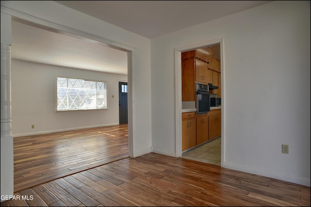 empty room with light wood-type flooring