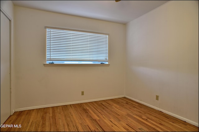 spare room with light hardwood / wood-style floors and a wealth of natural light