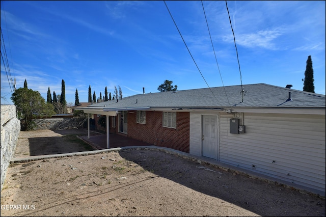 back of property with a patio