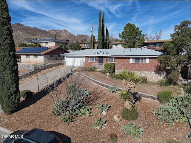 single story home with a mountain view