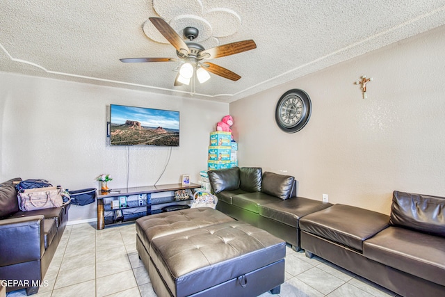 tiled living room with ceiling fan and a textured ceiling