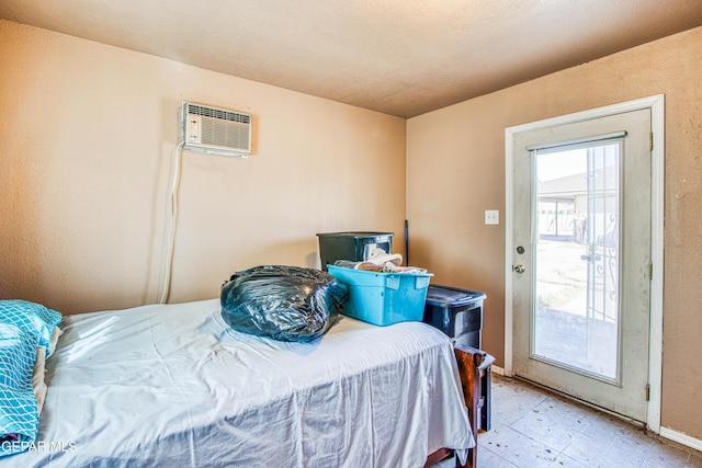 bedroom featuring a wall mounted air conditioner