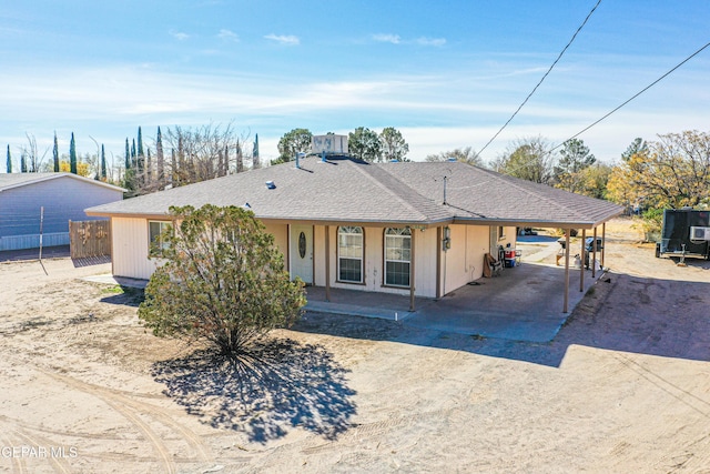 ranch-style house with a carport