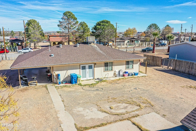 back of property with french doors and central air condition unit