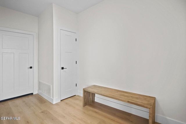 hallway featuring light wood-type flooring