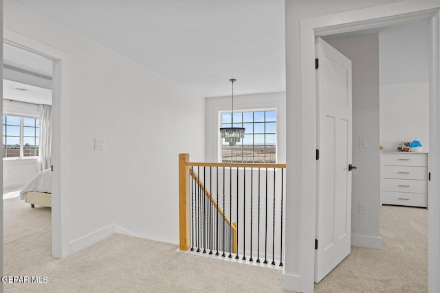 hallway featuring light carpet