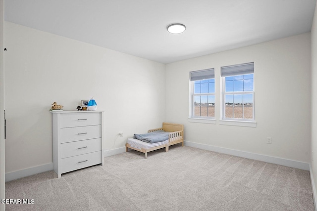 living area featuring light carpet