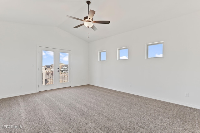 carpeted spare room featuring french doors, vaulted ceiling, and ceiling fan