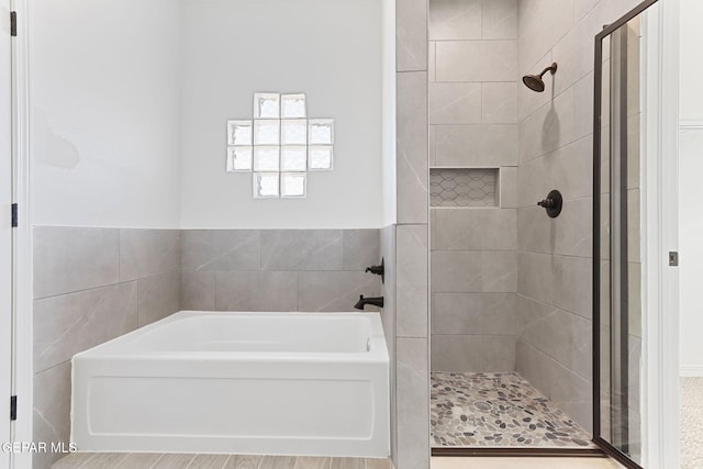 bathroom with shower with separate bathtub