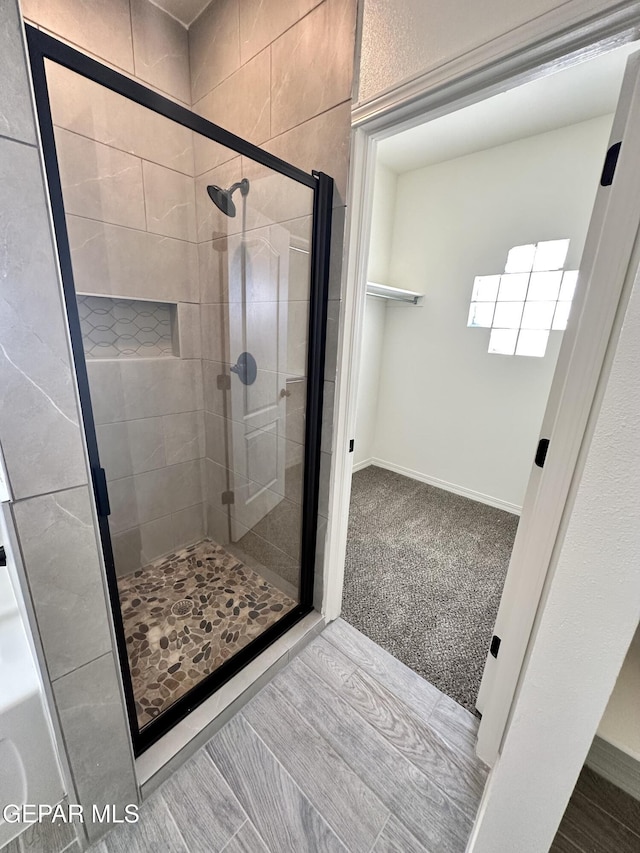 bathroom featuring walk in shower