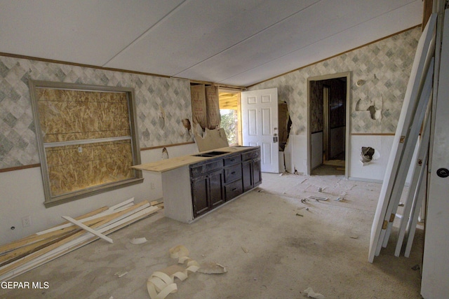 bathroom featuring lofted ceiling