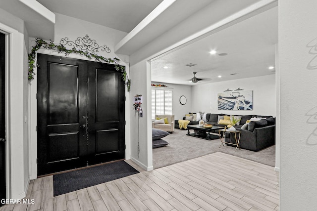 entryway with ceiling fan and light wood-type flooring