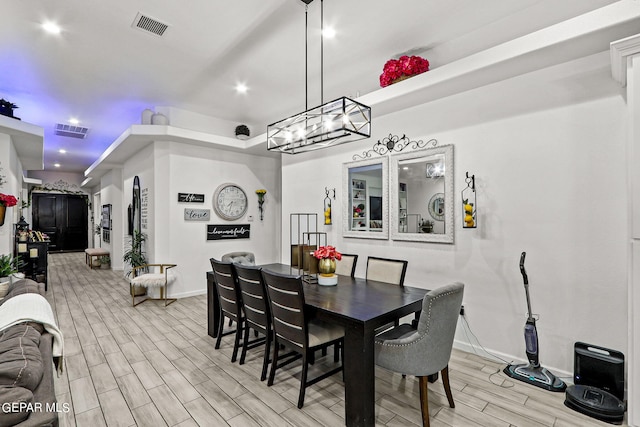 dining space featuring light wood-type flooring